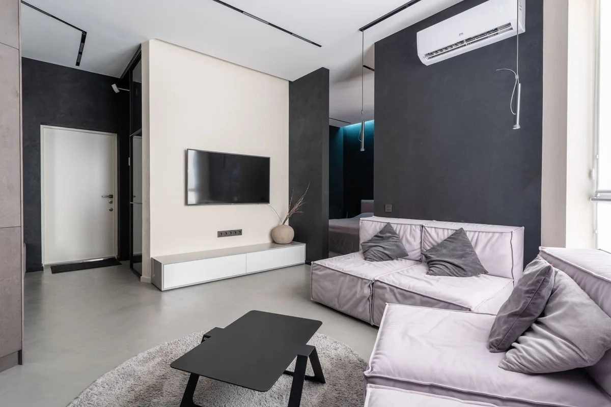 Living-room seating facing a wall-mounted television.